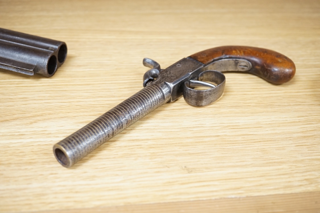 A boxlock percussion pocket pistol with turn off barrel inlaid with spiral brass wire for full length, plain frame and rounded walnut grip, probably Belgium made
